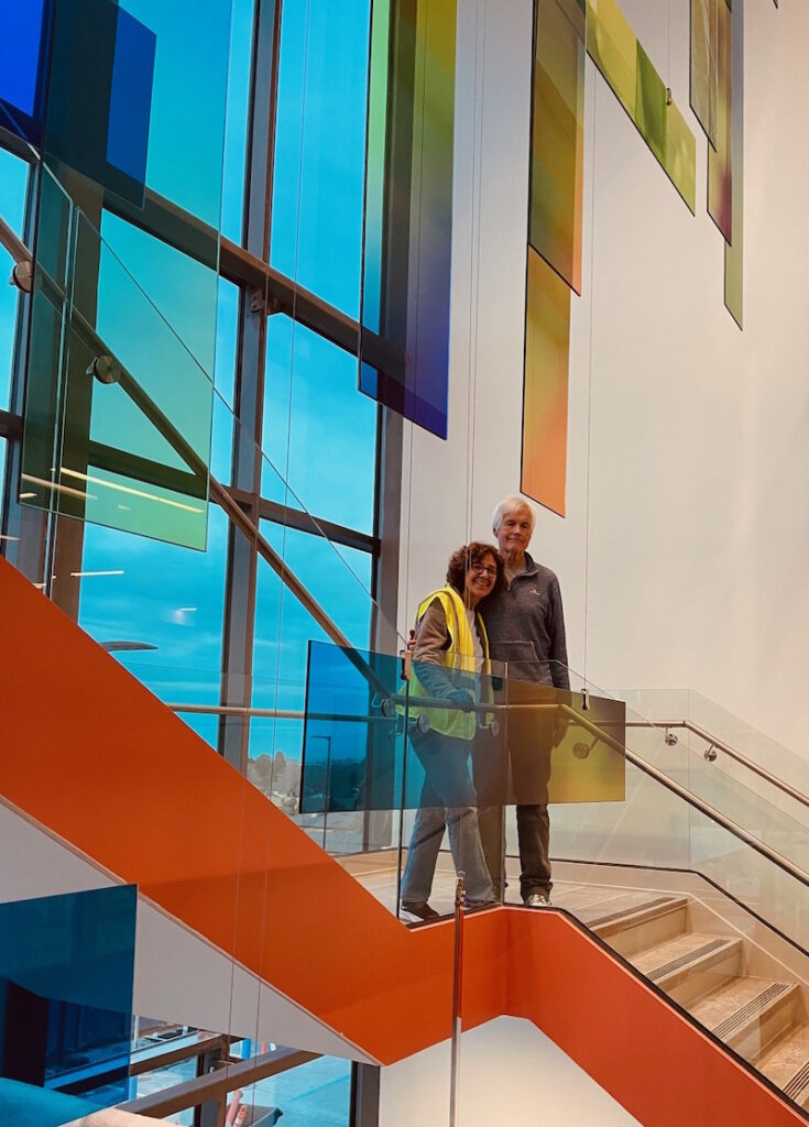 Photo: Judy & Dale Collins at Lakewood Kaiser Permanente with glass installation